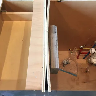 The sides of these two boxes used to be parallel, but they cut the sink hole in the wrong place and busted my cabinets to try to fit it.