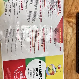 a menu and a phone on a table