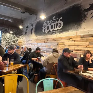 a group of people eating at a restaurant