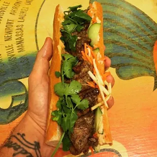 Banh Mi -
Grilled Pork Tenderloin | Jalapeño | Cucumber | Pickled Apples &amp; Carrots | Sriracha Aioli | White Bean Pate | Cilantro | Baguette