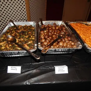 a variety of food items on a buffet table