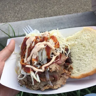 50/50 sandwich with slaw and blast furnace sauce