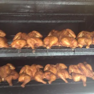 Half chickens in the smoker