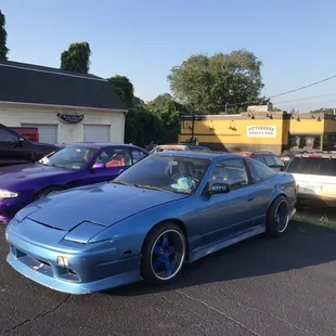 a blue car parked in a parking lot