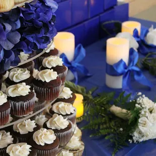cupcakes and candles on a table