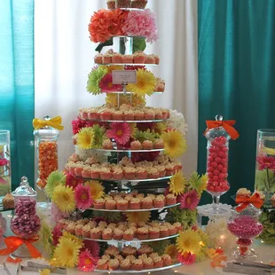 a wedding cake with cupcakes