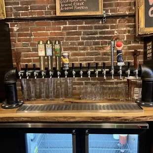 a bar with beer taps