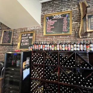 a brick wall and wine rack
