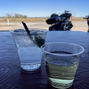 two glasses of water and a motorcycle