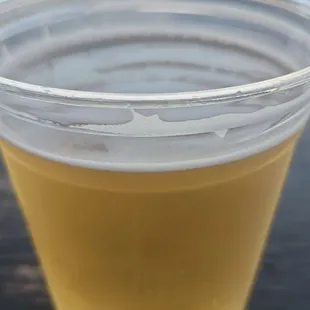 a plastic cup filled with liquid