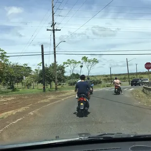 Moped cruising. Haleiwa Town.