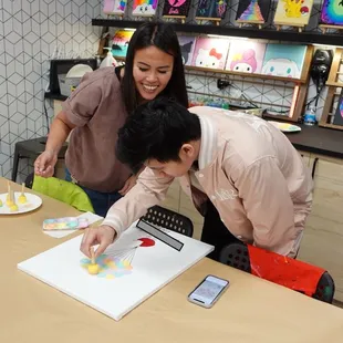 Mai helped our guests paint the keepsake canvas - such a wonderful touch!