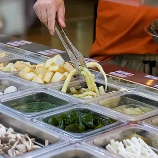 Build your dream bowl at the self-serve bar! Load up on noodles, spice it up, and dive into your custom Malatang masterpiece.