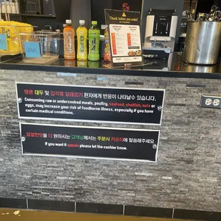 a counter with a menu on it