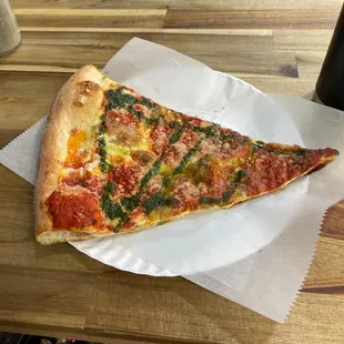 Margarita pizza slice sop up