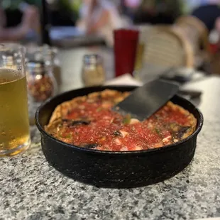 Small deep dish pizza.  And cold beer.