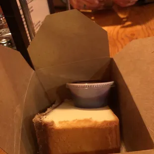 a box with a piece of bread in it