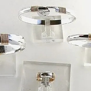 Sterling silver and 14k gold filled, 3 styles of bracelets and a ring with 4 wraps.