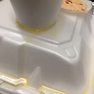 Butter that drenched other plates and the bottom of the bag. Terrible placement.