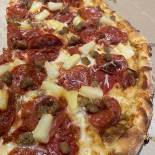 3 meat pizza with pineapple added
