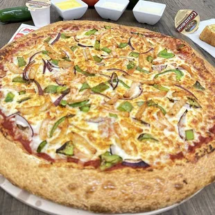 a whole pizza on a plate