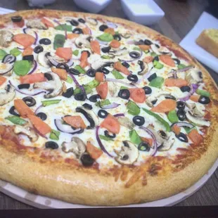 a pizza on a plate on a table