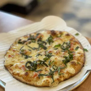  a pizza on a paper plate