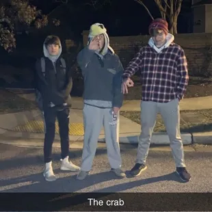  a group of skateboarders on a street at night