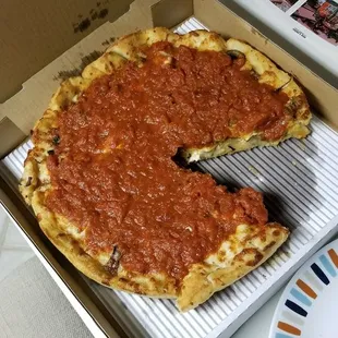 Double deep dish pizza with chicken, Italian sausage, onions, and, of course, hatch green chiles!
