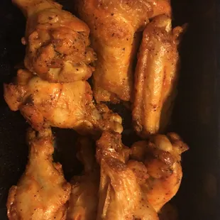 a plate of chicken wings