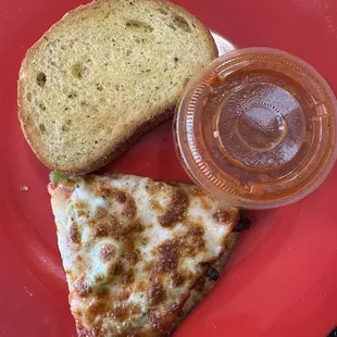 A slice of pie, garlic bread, and marinara.