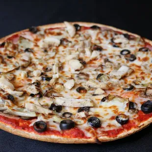 a pizza with olives, mushrooms, and cheese