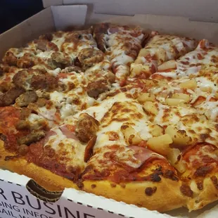 Half all meat and half pineapple and ham (Canadian bacon, whatevs)