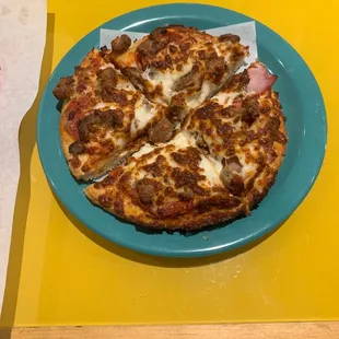 Personal all meat pizza.