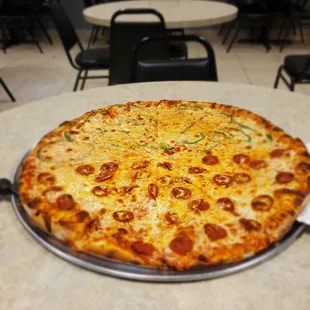 Large extra cheese. Half pepperoni and half green peppers