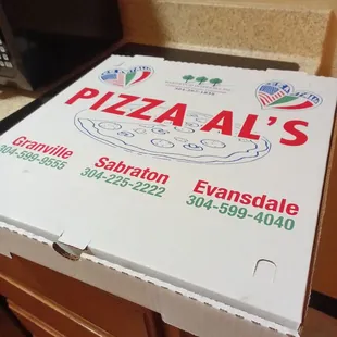 a pizza box on a counter