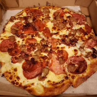 Pizza Amigos Meat Deluxe pizza, medium.  Delicious!