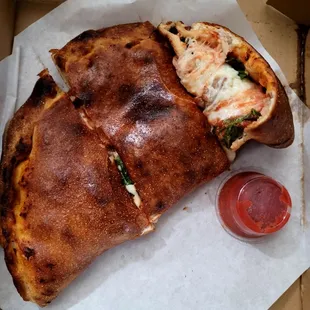 Calzone was overcooked/slightly burnt and lacked flavor.