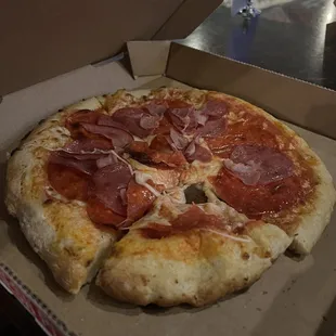 a pepperoni pizza in a box