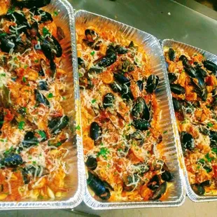 four trays of food