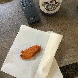  hot dog and a remote control