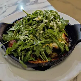 LASAGNA BOLOGNESE with pork and beef Ragu, three-cheese blend, prosciutto ricotta topping, arugula