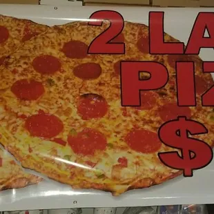 2 large pizzas 1 topping $10.99