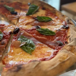 Margherita pizza plus olives &amp; prosciutto