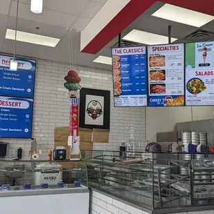 a restaurant with menus on the wall