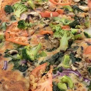 a pizza with vegetables on it