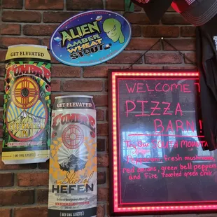 a brick wall with a neon sign