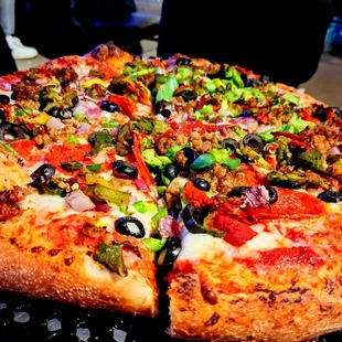 Supreme pizza with green chile