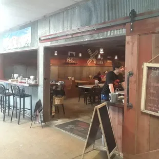 Store front. Big barn door closure.