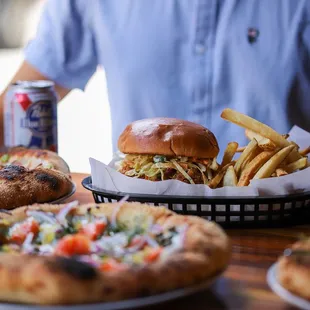 a man sitting at a table with food